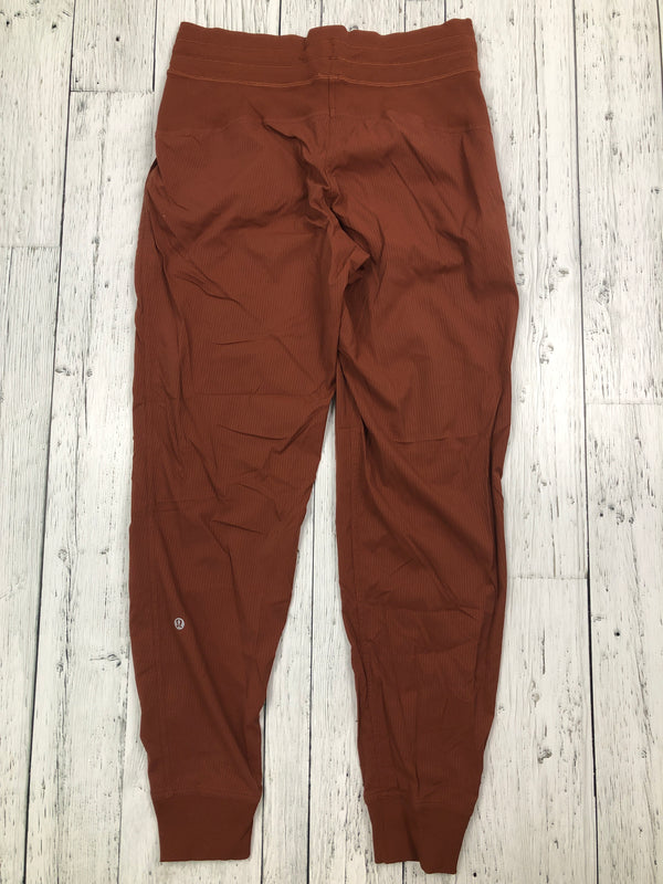 lululemon orange loggers - Hers S/6